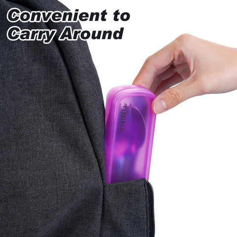 Hand placing rainbow finish 4 Piece Stainless Steel Travel Utensils Set with reinforced case into a backpack side pocket.
