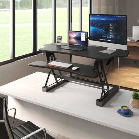 Standing Desk Converter 48 Inch Wide Sit Stand Desk Riser With Dual Gas Spring Handles, height adjustable on desk with monitors