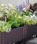 Two Piece Rolling Garden Bed Kit With Self Watering Design In Brown Plastic Outdoor Elevated Planter Boxes On Wheels being watered