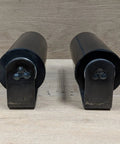 Front view of a pair of 6 inch rubber top guide gate rollers for sliding gates, heavy duty wheels in black, weld on.