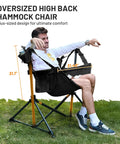 Person relaxing in Big Ol Oversized Hammock Camping Chair For Outdoors Ultra Comfort Up To 400 Lbs with adjustable backrest.