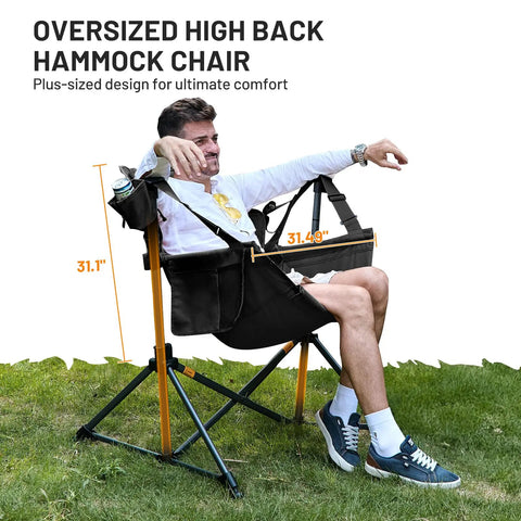 Person relaxing in Big Ol Oversized Hammock Camping Chair For Outdoors Ultra Comfort Up To 400 Lbs with adjustable backrest.