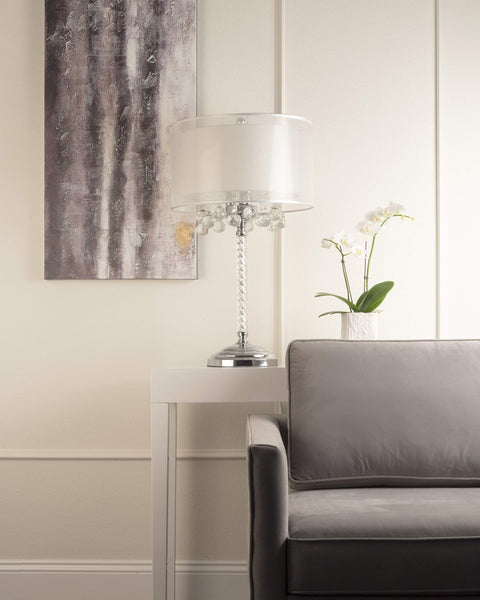 Moiselle Swanky Modern Table Lamp With Chrome Finish, Double Drum Shade In Sheer Off White, on side table in living room