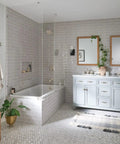 Modern bathroom with double vanity, freestanding bathtub, and Brushed Nickel Double Robe Hook for bathroom and kitchen walls.
