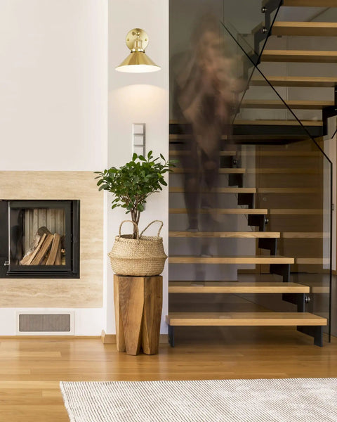 Gold Vintage Wireless Battery Operated Wall Sconces Set Of 2 With Remote Control next to modern wooden staircase in living room.