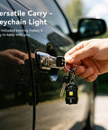 Hand using Ultra Bright 500 Lumen USB Rechargeable Small Flashlight Keychain Light in car door