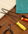 3 Pack Chainsaw File Set With 5/32 Inch, 7/32 Inch, And 3/16 Inch Round Sharpening Files, Plastic Handle, on a workbench