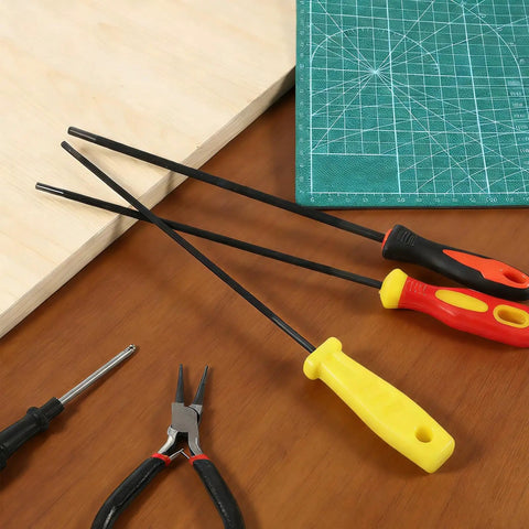 3 Pack Chainsaw File Set With 5/32 Inch, 7/32 Inch, And 3/16 Inch Round Sharpening Files, Plastic Handle, on a workbench