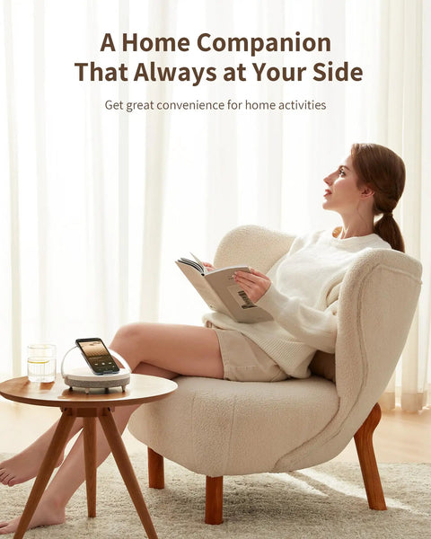 4 In 1 Bedside Lamp With Bluetooth Speaker Dimmable Night Light Charging Station And Phone Holder on round table near a woman reading.