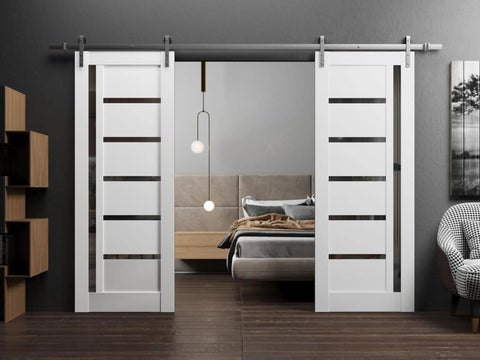 Sturdy Double Barn Door Kit With White Silk Panels And Black Glass, 72x96 Inches, installed in a modern bedroom interior.