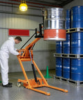 Compact Foldable Electric Stacker With 1543 Lbs Lifting Capacity, Articulated Boom Forklift For Tight Spaces, lifting a metal drum.