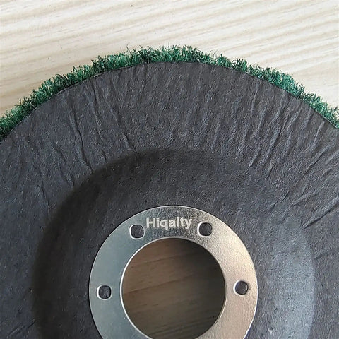 Super Tough 5 Inch Nylon Fiber Flap Disc With 125mm Size And 22mm Arbor Fits Your Angle Grinder close-up view showing nylon fibers and metal arbor.