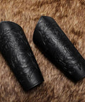 Badass Medieval Faux Leather Bracers Featuring Dragon And Viking Embossing, Adjustable Steampunk Punk Gothic Arm Cuffs, Dope Cosplay Halloween Accessories Set For Tough As Nails Adventure Games And Party Wear on fur background.