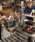 Heavy Duty Industrial Thermal Transfer Label Printer Built Different With A Rugged Metal Chassis on a warehouse workstation.