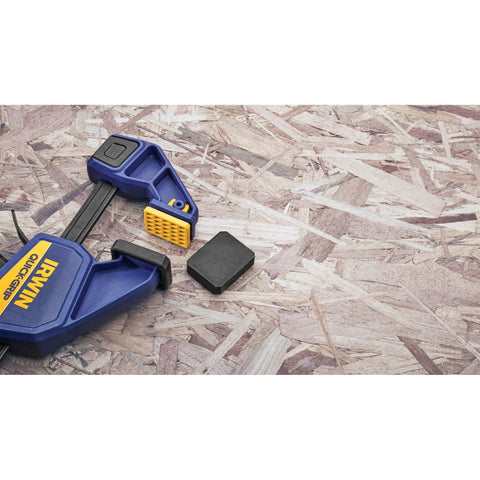 IRWIN Quick-Grip mini bar clamp, 6-inch, blue with yellow jaw; front view with spare pad nearby.