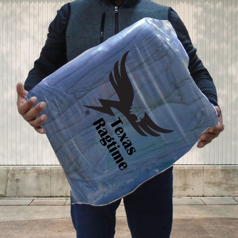 Man holding package of Blue Industrial Cloth Rags for Auto Mechanics and Janitorial Work, Heavy Duty, Low Lint, Durable and Reusable