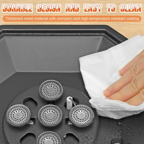Close-up of a burner grate being wiped clean from the Two Burner Propane Camping Stove 34000 BTU Foldable Outdoor Gas Stove