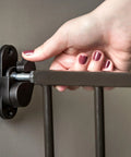 Adjusting hardware of Extra Tall Baby Gate For Stairs And Doorways Walk Through With Door Hardware Mounted Gate For Babies Toddlers And Pets.