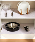 Top Shelf Nonslip Shelf Liner For Kitchen Cabinets And Drawers, White Non Adhesive Mat in a cabinet with pots and utensils.