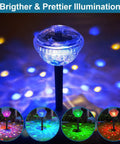 Close-up of Solar Pathway Lights Outdoor 4 Pack With Auto Color Changing Waterproof Super Bright LED Path Lights in garden display