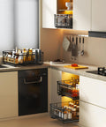 Kick Pantry Chaos To The Curb With This 2 Pack Expandable Pull Out Cabinet Organizer Built For Deep Drawers featuring black metal baskets filled with jars in a modern kitchen.