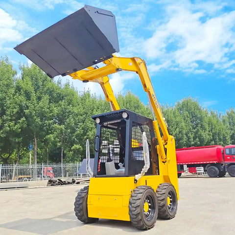 Yellow heavy duty skid steer loader with bucket attachment, hydraulic boom 4x4 on construction site, sunny day, trees in background