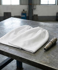 Heavy Duty Canvas Sandblast Sleeves For Sandblasting Cabinets Abrasion Resistant Arm Guard Workwear on a metal workbench.