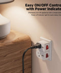 No Sweat Setup Real Deal Grounded Outlet Switch 3 Pack White Wall Power Control Toggle With Glowing Status Indicator Light For Quick Home Energy Savings And Total Peace Of Mind plugged into a bedside outlet.