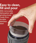 Hand removing grinding bowl from Fresh Grind Electric Coffee Grinder for Beans, Spices with stainless steel blades and easy cleanup.