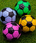 Soccer Themed Novelty Golf Balls 12 Pack With 360 Degree Soccer Design in assorted colors on grass