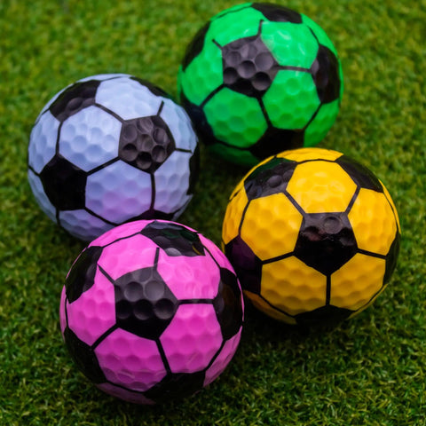 Soccer Themed Novelty Golf Balls 12 Pack With 360 Degree Soccer Design in assorted colors on grass