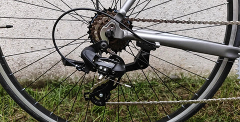 Bike rear wheel with 8 Speed Freewheel 13-28T Screw-On Replacement Part For Most Bikes Black And Brown Finish Universal Fit visible