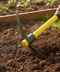 Double Headed Pick Mattock Hoe 15-Inch Garden Tool With Forged Steel Head And Fiberglass Handle in use on soil