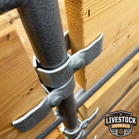 Heavy Duty Galvanized Horse Panel Clamps Fit 1 5 8 Inch Livestock Corral Fencing Attaches Wood Boards To Round Pens And Stall Walls No Weld Barn Setup Quick No Sweat Install 8 Pack close-up view of clamp securing wooden board to round pen.