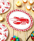 Rad Lobster Themed Oval Paper Plates 12 By 10 Inch 50 Pack Disposable Seafood Boil Dishes on a wooden table with desserts.