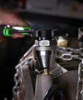 Durable Universal Stud Extractor For Damaged Bolts And Broken Studs, Fits 1/4 To 1/2 Inch Studs in use with a wrench on an engine block