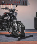 Heavy Duty Motorcycle Wheel Chock Stand With 1800 Lb Capacity Steel Construction 6 Adjustable Holes Fits 15 To 22 Inch Wheels Works With Off Road And Street Bikes Built To Last Tough As Nails For Real World Use securing a motorcycle in a garage setting