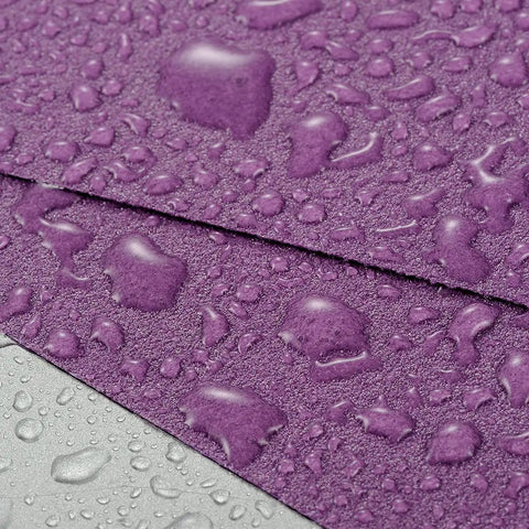 Close-up of 600 Grit Wet Dry Sanding Sheets 9 By 11 Inch Set White Fused Alumina Abrasive Pro Grade for finishing with water droplets