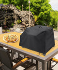 Heavy Duty Waterproof Pizza Oven Cover For Cuisinart CGG403 3 In 1 Portable Pizza Oven All Season Weatherproof Shield on outdoor table