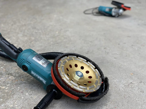 Universal 7 Inch Dust Shroud For Angle Grinders With Vacuum Hose Adapter Fits Most Major Brands on a concrete surface