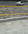 Dead Easy Osha Compliant Industrial Safety Railing With Vivid Yellow Finish And One Piece Welded Base Plates For Quick Plug And Play Surface Mounting, shown on concrete.