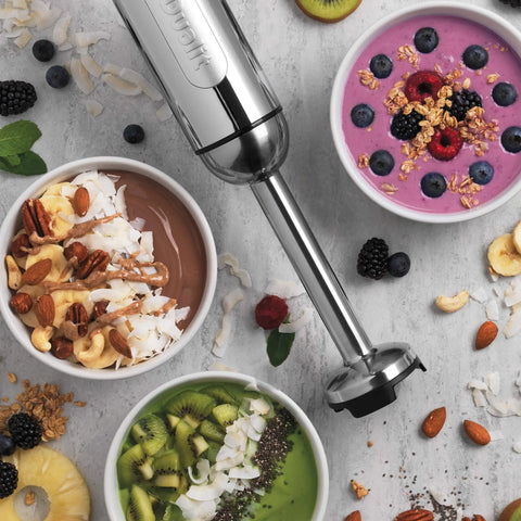 Heavy Hitting Immersion Blender Set With A Versatile Chop Bowl Whisk And Non Drip Measuring Jug Powered By 700W Turbo Motor In Polished Chrome Finish making smoothies in bowls.