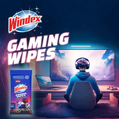 Person wearing headset at gaming desk next to a pack of Windex Gaming Wipes, product for cleaning consoles and electronics.