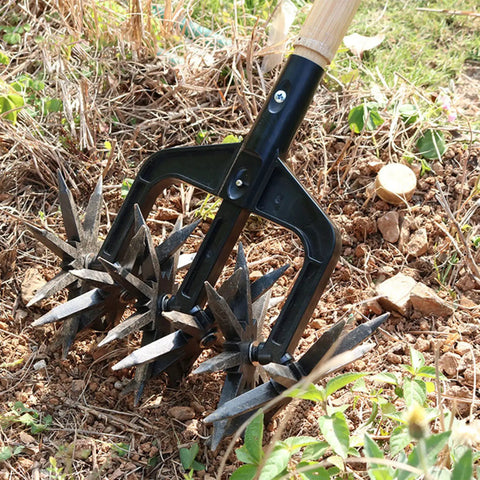 Manual Garden Cultivator With Interchangeable Handheld Scarifier And Handle Attachment in use on soil