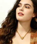 Woman wearing 14k Gold Plated Initial V Necklace with Heart Pendant, Waterproof Stainless Steel, 45cm Chain Plus 5cm Extension.