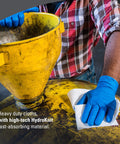 Person using X80 Heavy Duty Cloths Brag Box White Industrial Shop Towels For Oil And Water Cleanup on yellow funnel