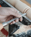 Hand using Dead On Precision Cryo Treated M2 High Speed Steel Bead Forming Chisel for Wood Lathe on a project.