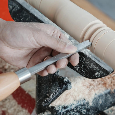 Hand using Dead On Precision Cryo Treated M2 High Speed Steel Bead Forming Chisel for Wood Lathe on a project.