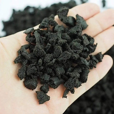 Hand holding Organic Plant Sponge Chips For Indoor And Outdoor Use, Soil Replacement, 0.5kg Pack, lightweight and durable sponge material.
