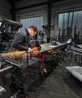Top Shelf 1400 Watt Angle Grinder Packs Knock Tough 125mm Cutting Muscle in action, creating sparks during metal work.